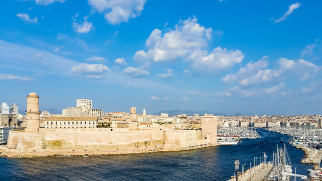 Marseille, France - The Old Port of Marseille with historical Fort Saint Jean and the lighthouse tower tour du fanal.