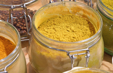 jar with yellow curry powder