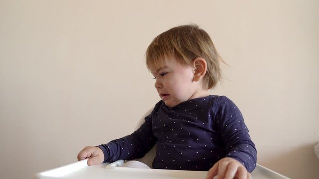 Screaming Loud Baby Toddler In Highchair. Hungry, Teething Or Meltdown Concept. Portrait