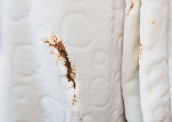 Obraz premium Woman spills coffee spot on white bathrobe. Dirty clothes.