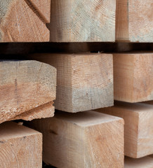 Wooden beams. Planks. Air-drying timber stack.