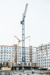 Construction site with heavy machinery with sky at background