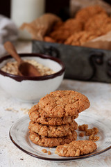 Homemade oatmeal cookies on white wooden table