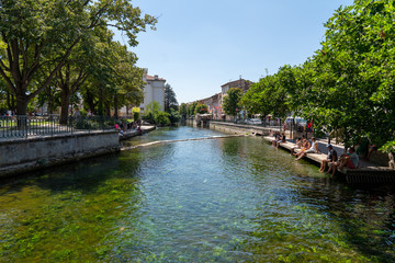 Fototapeta na wymiar Village of L'Isle-sur-la-Sorgue river canal in Provence France
