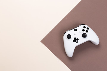 White joystick gamepad, game console on colorful background. Computer gaming technology play competition videogame control confrontation concept. Cyberspace symbol