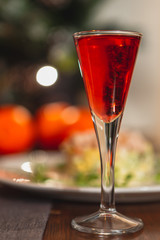 many glasses of shot or liqueur. Friends drink shot or liqueur and cheers. alcohol on blurred table background. Party and toast concept.