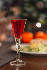 Set of glasses with different colored tinctures made on the basis of fruits and alcohol, a wonderful aperitif before the festive dinner