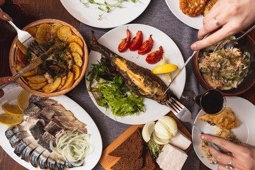 A generous and hospitable table with Ukrainian national traditional vegetable and meat dishes served to the New Year holidays, Christmas, Easter and treats for friends birthday. Top view