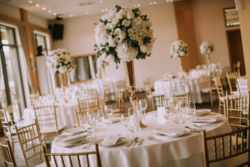 Wedding banquet tables with flowers decoration