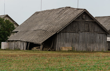 Naklejka premium Old wooden buildings in the village, built in the middle of the last century.