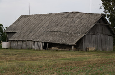 Fototapeta premium Old wooden buildings in the village, built in the middle of the last century.