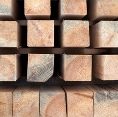 Wooden beams. Planks. Air-drying timber stack.