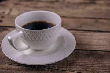 cup of coffee on wooden table