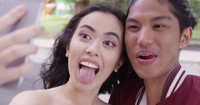 Young attractive couple take a silly selfie.  - Slow Motion - shot on RED