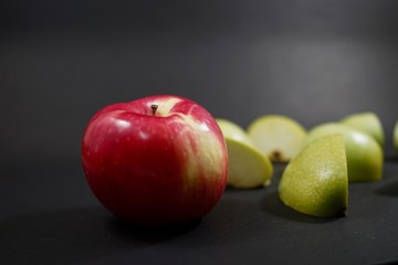 red apples on black wooden table