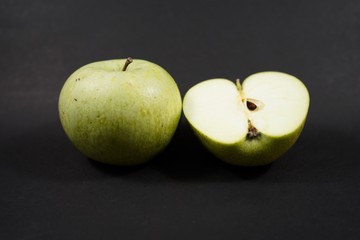 green apples on a black background isolate