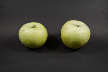 apples on black background