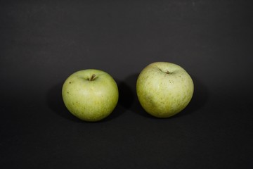 green apples isolate on black background