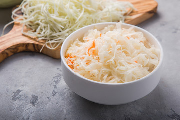 Homemade sauerkraut village fermented cabbage. Vegan salad rustic style  organic vegetable  great for good health. Traditional russian winter meal. Probiotics food concept.