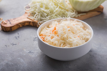 Homemade sauerkraut village fermented cabbage. Vegan salad rustic style  organic vegetable  great for good health. Traditional russian winter meal. Probiotics food concept. - obrazy, fototapety, plakaty