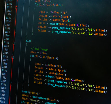 Fragment PHP code on dark background in code editor. Close-up of a laptop screen with the code written.