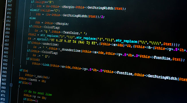 Close-up of a laptop screen with an open program for editing the source code of the website, which the programmer codes in php.