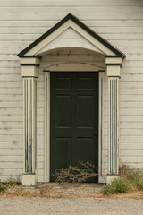 Old house with unkept entryway and door