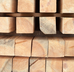 Wooden beams. Planks. Air-drying timber stack.