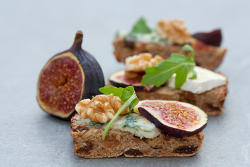Tasty open sandwiches with fig fruits.