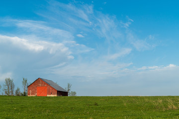 old red barn and blue sky