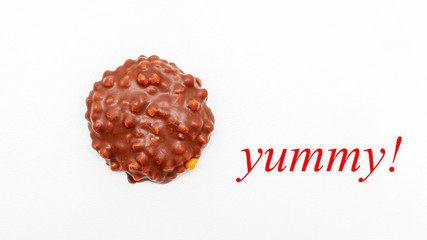 Cookies with chocolate icing, inscription: yummy! white isolated background, 16:9