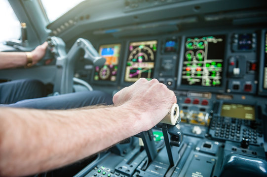 A Pilot hands controlling airplane