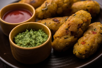 Veg Poha Roll made using flattened Rice, served with tomato ketchup and green chutney