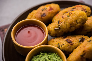 Veg Poha Roll made using flattened Rice, served with tomato ketchup and green chutney