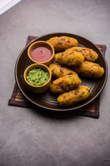 Veg Poha Roll made using flattened Rice, served with tomato ketchup and green chutney