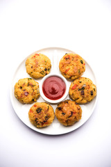 Veg Poha Cutlet or flattened Rice Patties served with tomato ketchup and green chutney