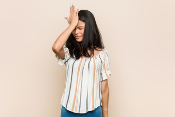 Obraz premium Young cute chinese teenager Young blonde woman wearing a coat against a pink background forgetting something, slapping forehead with palm and closing eyes.