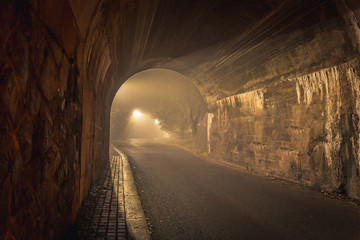 The Tunnel. Way out with spooky mist and fog at night.