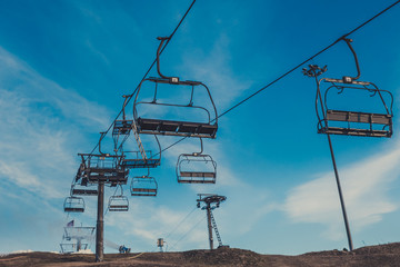Empty ski lifts under blue sky