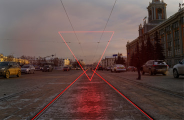Modern cityscape with pink neon triangle
