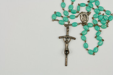 Rosary isolated on white background.