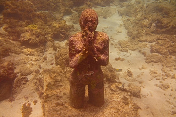 Underwater Sculpture of Girl Praying