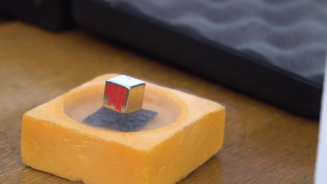 Superconductor and nitrogen - experience with liquid nitrogen cooling and magnet levitation. Quantum levitation. 4k footage.