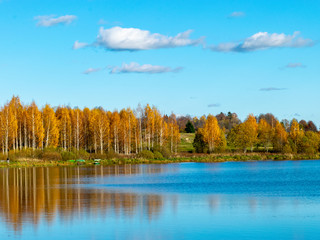 colorful autumn landscape by the lake, golden autumn, colorful trees and reflections