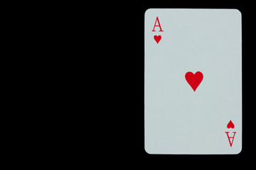 Ace of hearts. Playing card isolated on black background.