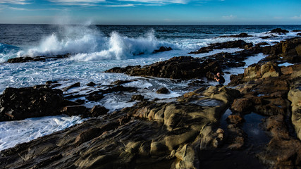 waves crashing on rocks