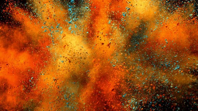 Super slow motion of coloured powder explosion isolated on black background. Filmed on high speed cinema camera, 1000fps.