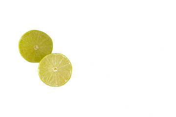 Two lime halves isolated on a white background with copy space