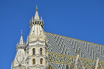 Fototapeta na wymiar Details of the roof and tower of the Stephansdom -St Stephans's church, one of the main touristic destination of Vienna.