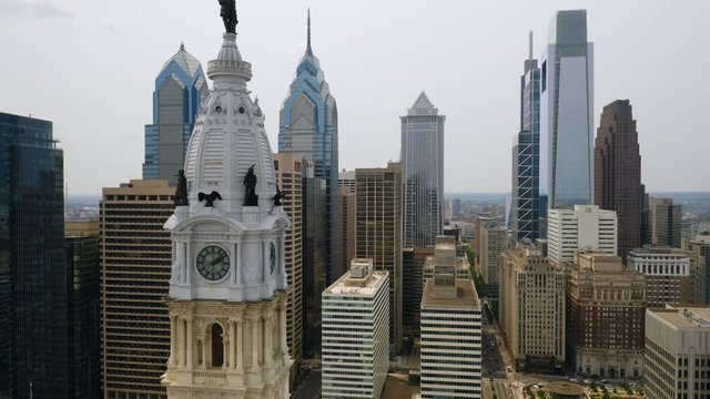 Close up aerial view of Philadelphia center city skyline and city hall tower featuring the William Penn statue